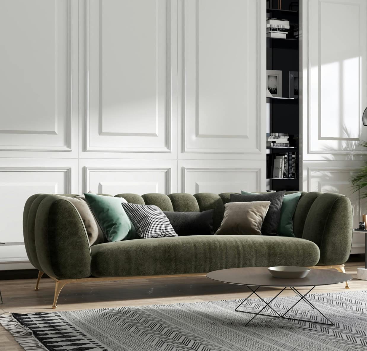 Green velvet sofa with plush cushions in a stylish, contemporary living room setting.