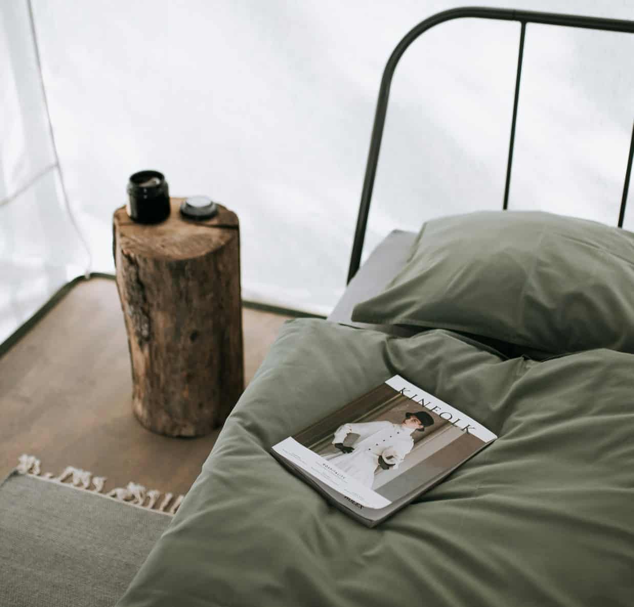 Elegant bedroom decor with natural wood accents and cozy bedding.