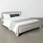 Elegant Altea bed with soft grey upholstery and sleek design for contemporary bedrooms.