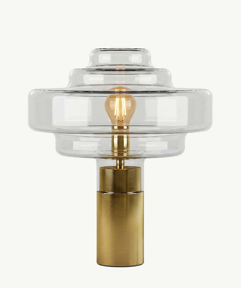 Elegant glass and brass art table lamp for modern home decor.