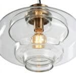 Pendant lamp with glass and brass design.