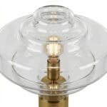 Elegant glass art table lamp with warm lighting.