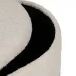 Elegant white textured puff with black accent for modern decor.