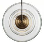 Elegant art pendant lamp featuring clear glass and brass accents for contemporary interior decor.
