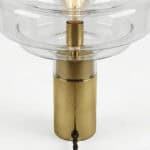Elegant art table lamp featuring a glass shade and brass base for stylish home decor.