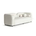 Elegant white Cabanes sofa with rounded armrests and cylindrical cushions. Perfect for modern living.