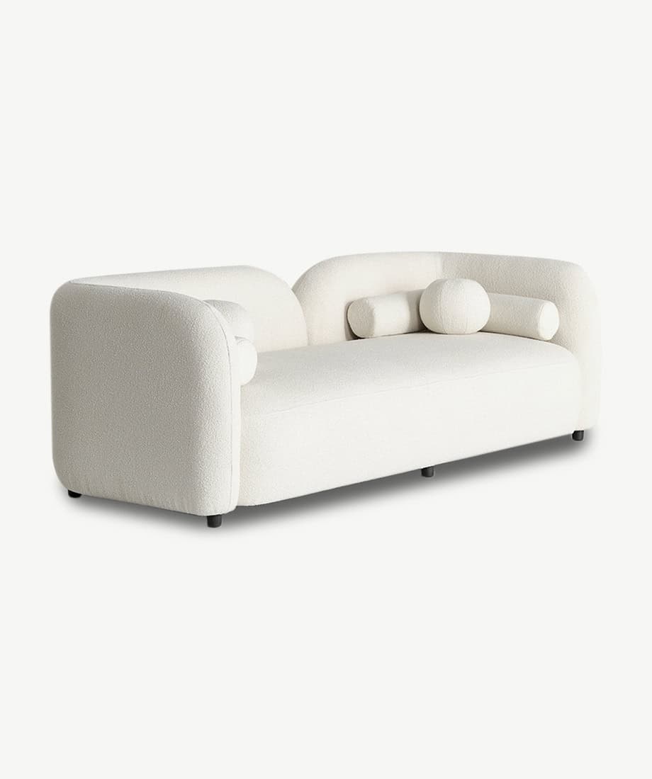 Elegant white Cabanes sofa with rounded armrests and plush cushions.