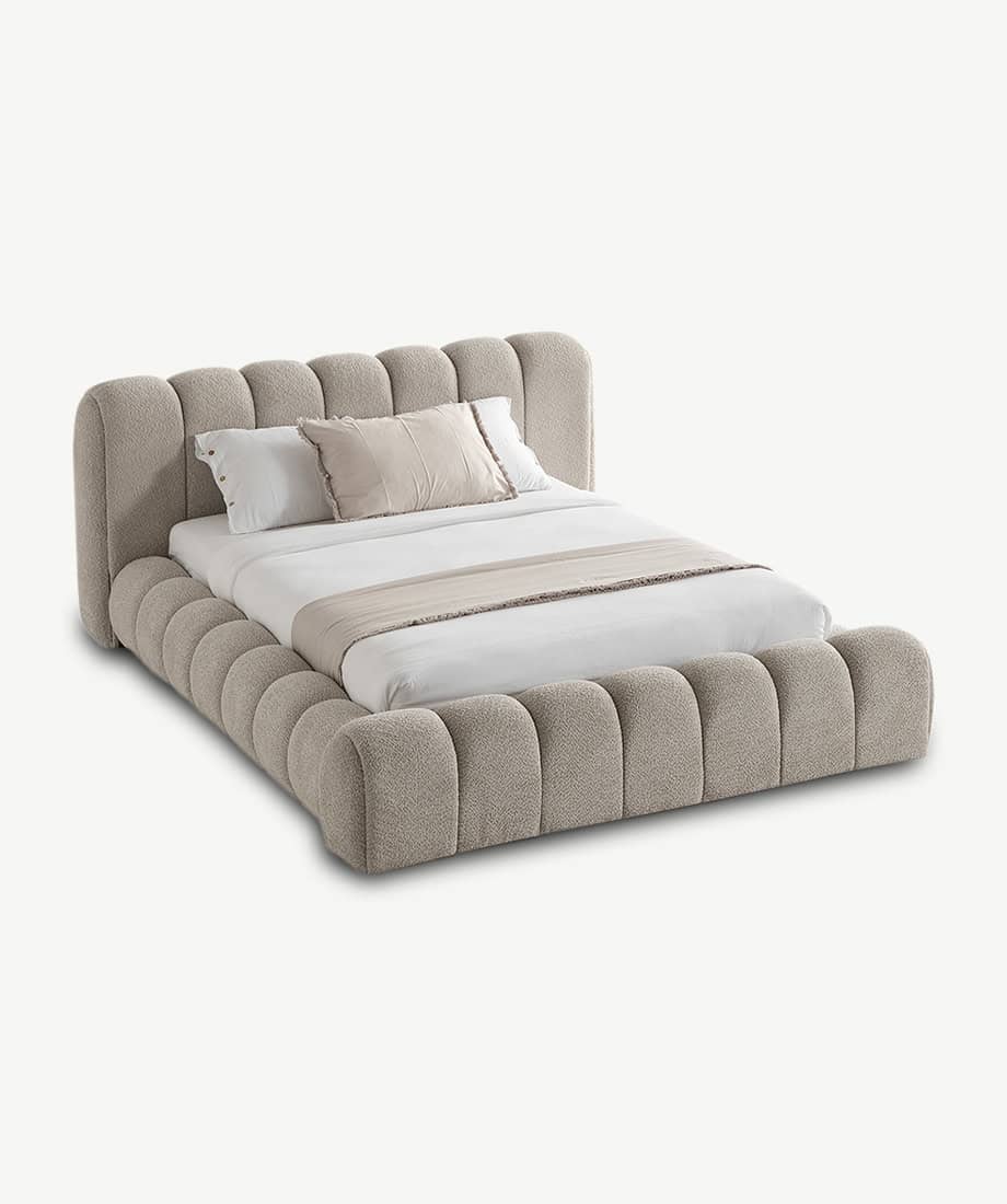 Elegant Carlet Bed with plush, rounded headboard and frame.