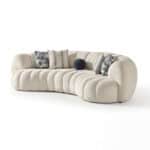 Elegant Morella sofa with plush, rounded design and decorative cushions for stylish comfort.