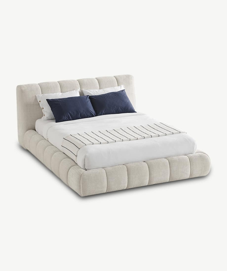 Novelda Bed with plush upholstery and elegant design.