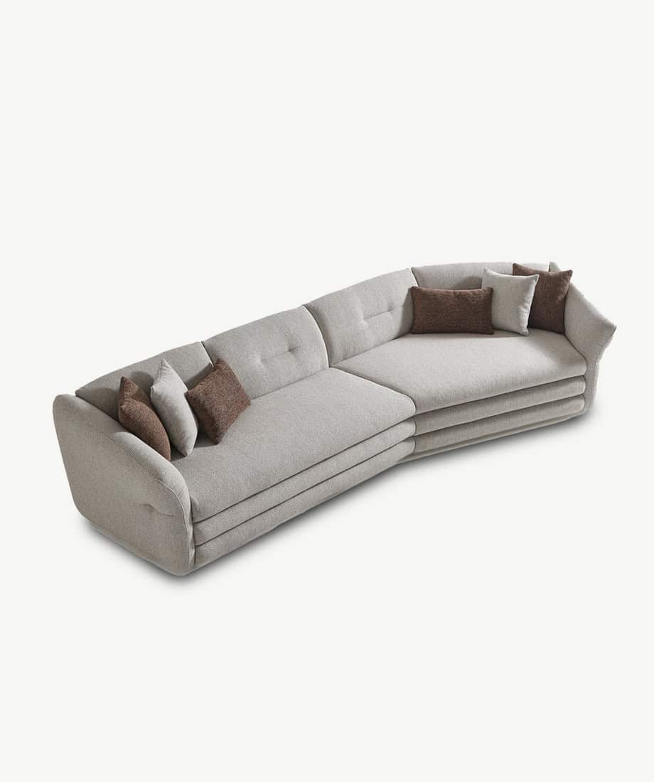 Elegant Alcora sofa with neutral tones and plush cushions for modern living rooms.