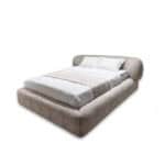 Ayora Bed with soft fabric and stylish headboard for a contemporary bedroom.