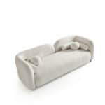 Elegant white Cabanes sofa with unique cylindrical armrest design.