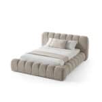Elegant Carlet Bed with plush, rounded upholstery for a contemporary bedroom look.