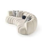 Elegant Morella sofa with plush, rounded design and decorative cushions for stylish comfort.