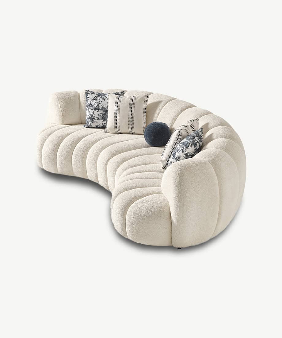 Modern Morella Sofa with plush curves and decorative pillows for stylish comfort.