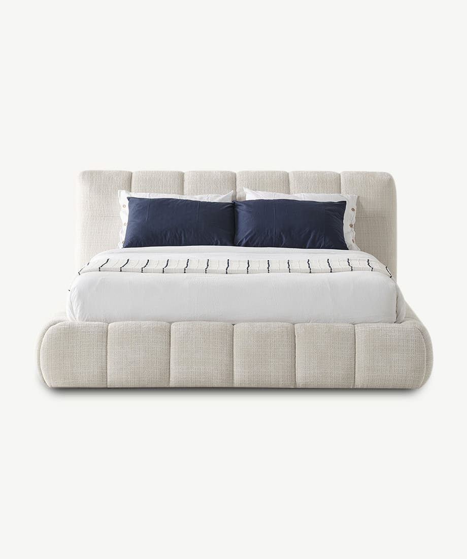 Elegant Novelda Bed with plush upholstery and modern design.