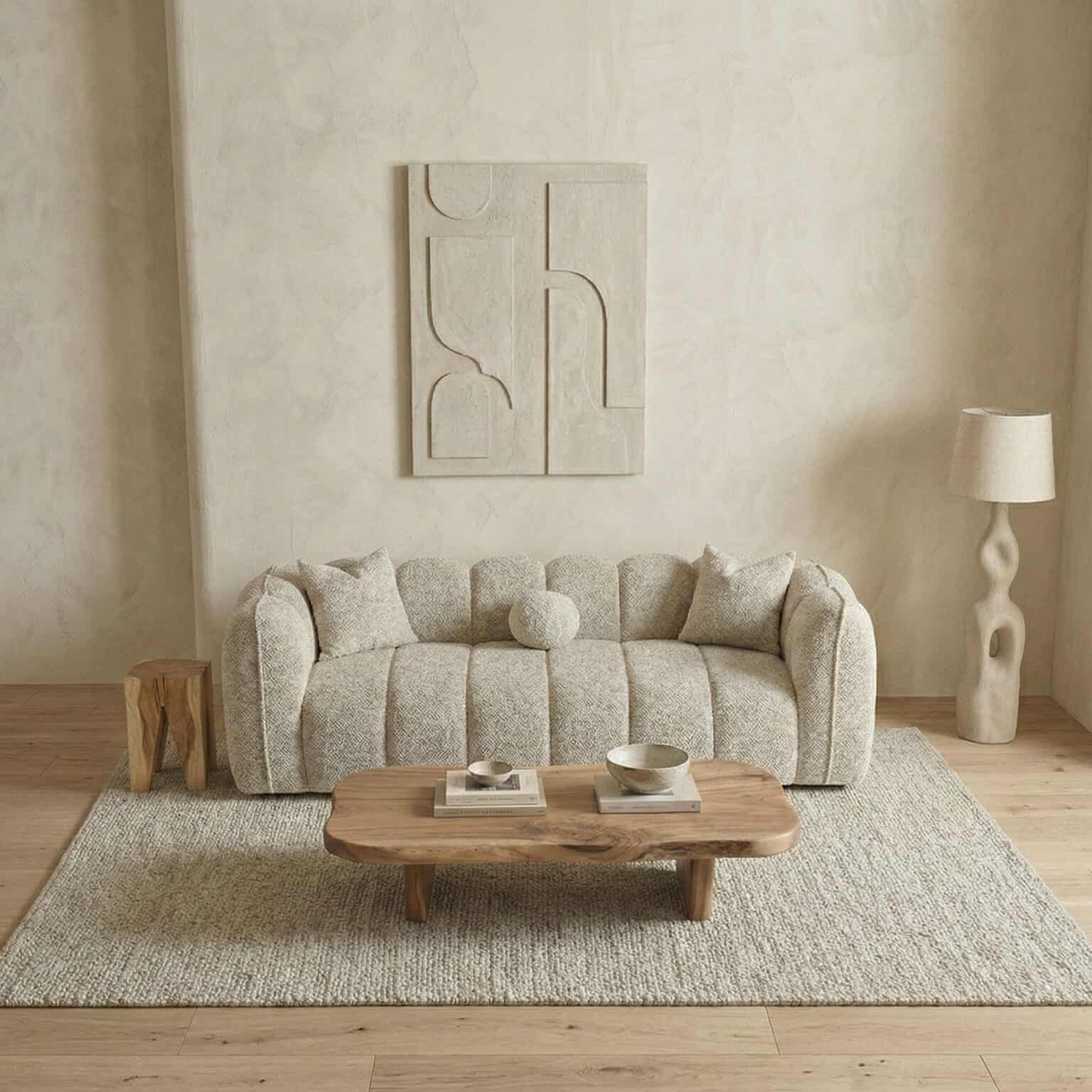 Elegant living room featuring a cozy sofa, abstract wall art, and stylish accessories.