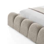 Elegant Carlet Bed headboard with soft, rounded fabric design.