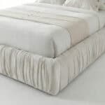 Elegant velvet upholstered Cheste bed with a plush, textured finish for a luxurious bedroom look.