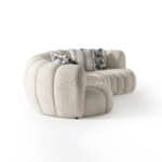 Elegant Morella sofa with plush, rounded design and decorative pillows. Perfect for modern living ro.