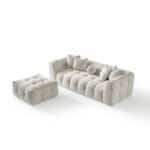Elegant Oropesa sofa with plush, tufted design in neutral tones.