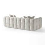 Elegant Oropesa sofa with plush tufted design in neutral fabric.