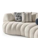 Comfortable and stylish Morella sofa with plush upholstery and decorative pillows. Perfect for conte.