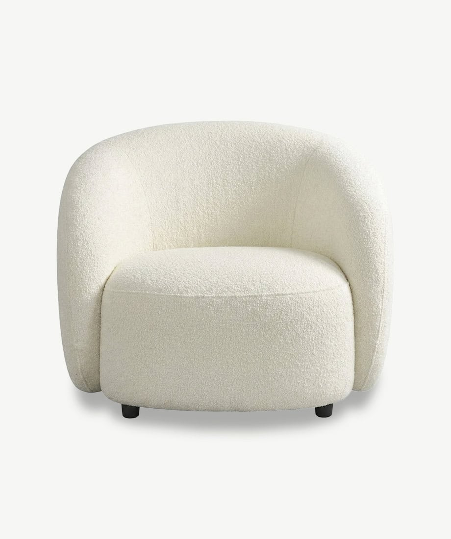 Elegant Villar armchair with plush, textured fabric in a soft cream color. Perfect for modern and co.