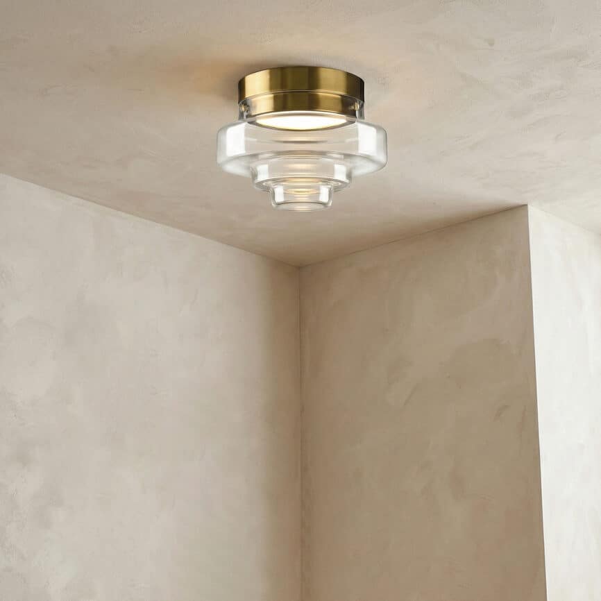 Art wall lamp with sleek gold and glass design.