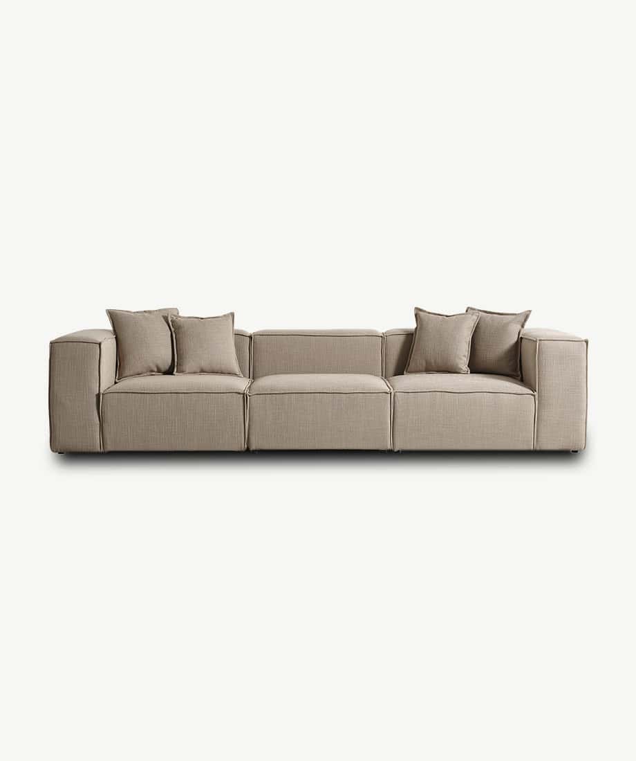 Elegant Godella sofa with neutral beige upholstery and plush cushions, perfect for contemporary livi.