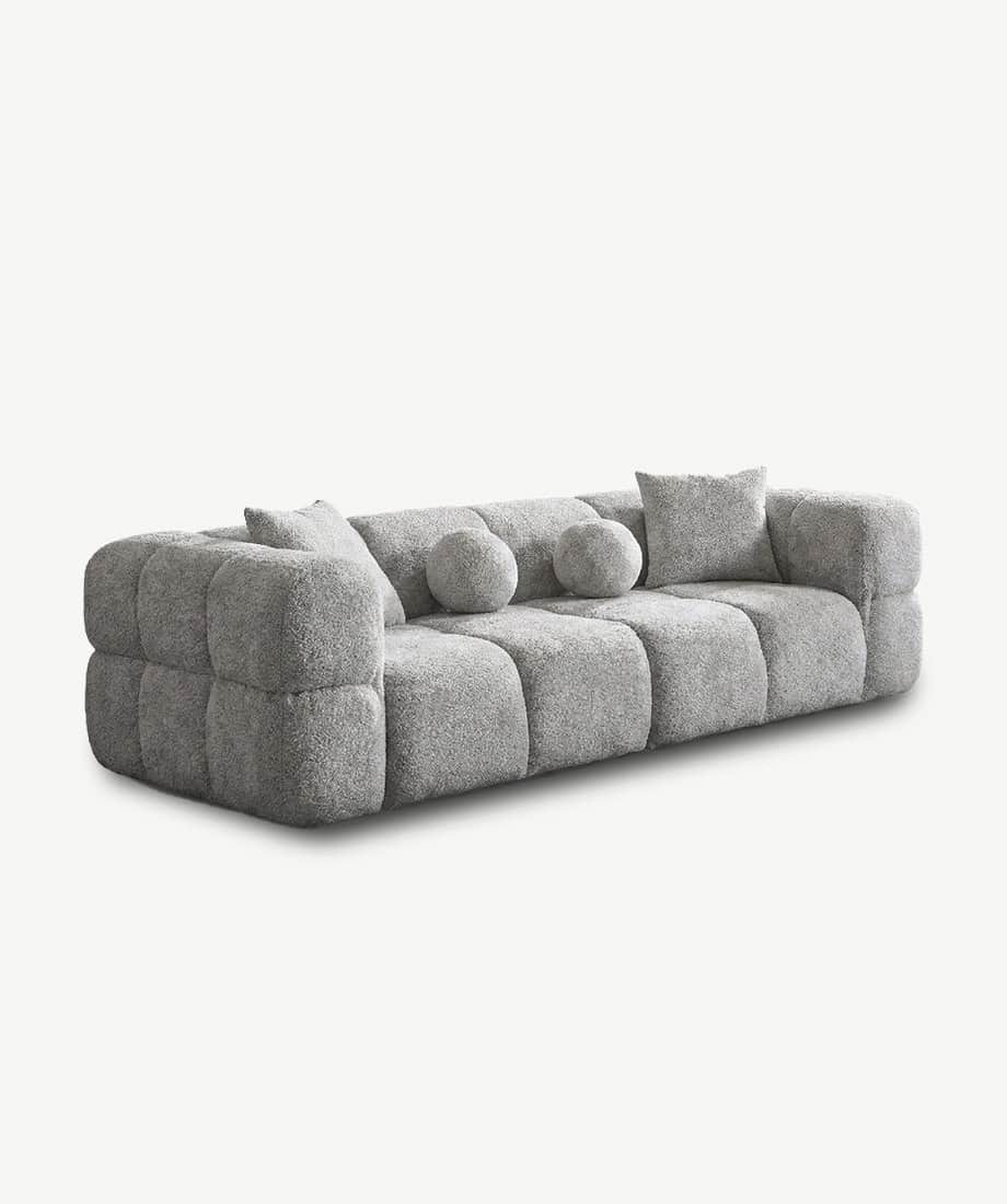 Artana sofa with plush, textured fabric and modern design. Perfect for contemporary living rooms.