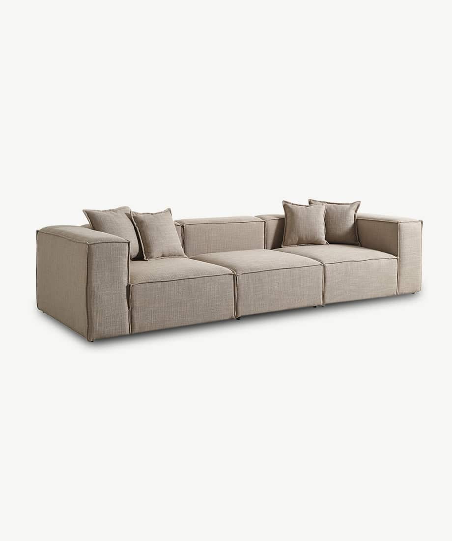Comfortable beige Godella sofa with cushions, perfect for modern living spaces.