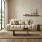 Elegant beige sofa with textured cushions in a contemporary living space.