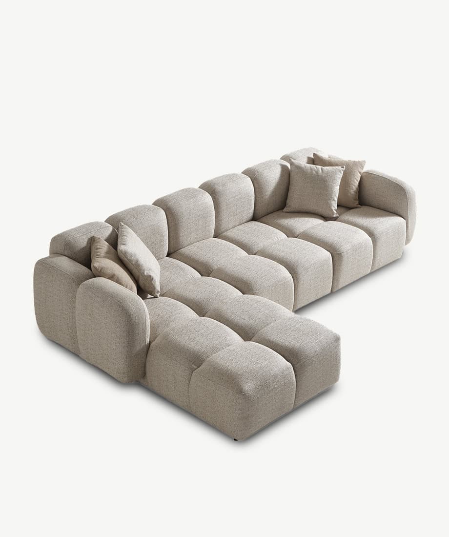 Comfortable Nules sofa with plush cushions and neutral fabric, perfect for contemporary living rooms.
