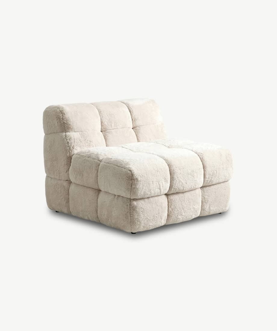 Soft Oropesa Puff armchair with plush fabric, perfect for contemporary home decor.