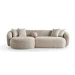 Modern beige sofa with plush cushions and rounded arms, stylish and comfortable.