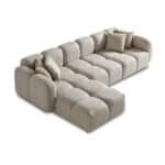 Elegant beige sectional sofa with plush cushions and modern design. Perfect for stylish living rooms.