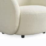 Elegant Villar armchair with plush, textured fabric for modern comfort. Perfect for stylish living s.