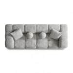 Contemporary grey Artana sofa with cushions and round pillows, stylish and comfortable for living ro.