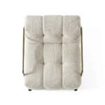 Armchair with plush beige upholstery and modern metal frame.