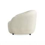 Villar armchair with plush, textured fabric in a soft cream color, perfect for modern living spaces.