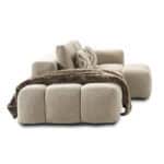 Elegant Betxi sofa with plush cushions and cozy throw blanket for stylish living spaces.