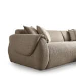 Elegant beige Forcal sofa with plush cushions and rounded armrests.