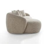 Elegant Tous sofa with plush fabric and cozy cushions.