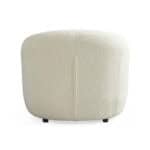 Elegant Villar Armchair with plush fabric and modern design. Perfect for stylish living rooms and co.
